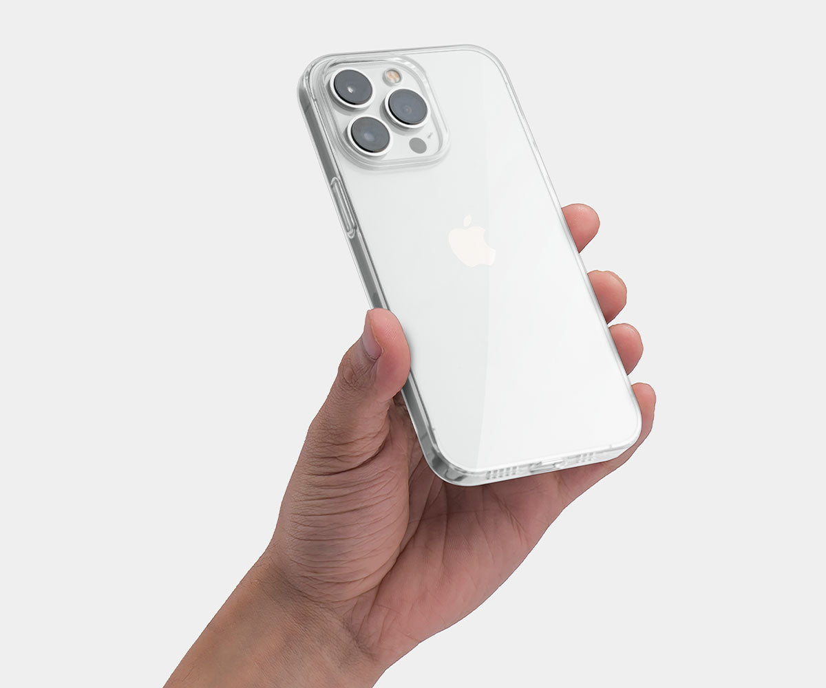 hand holding a phone with a clear iPhone 14 pro case