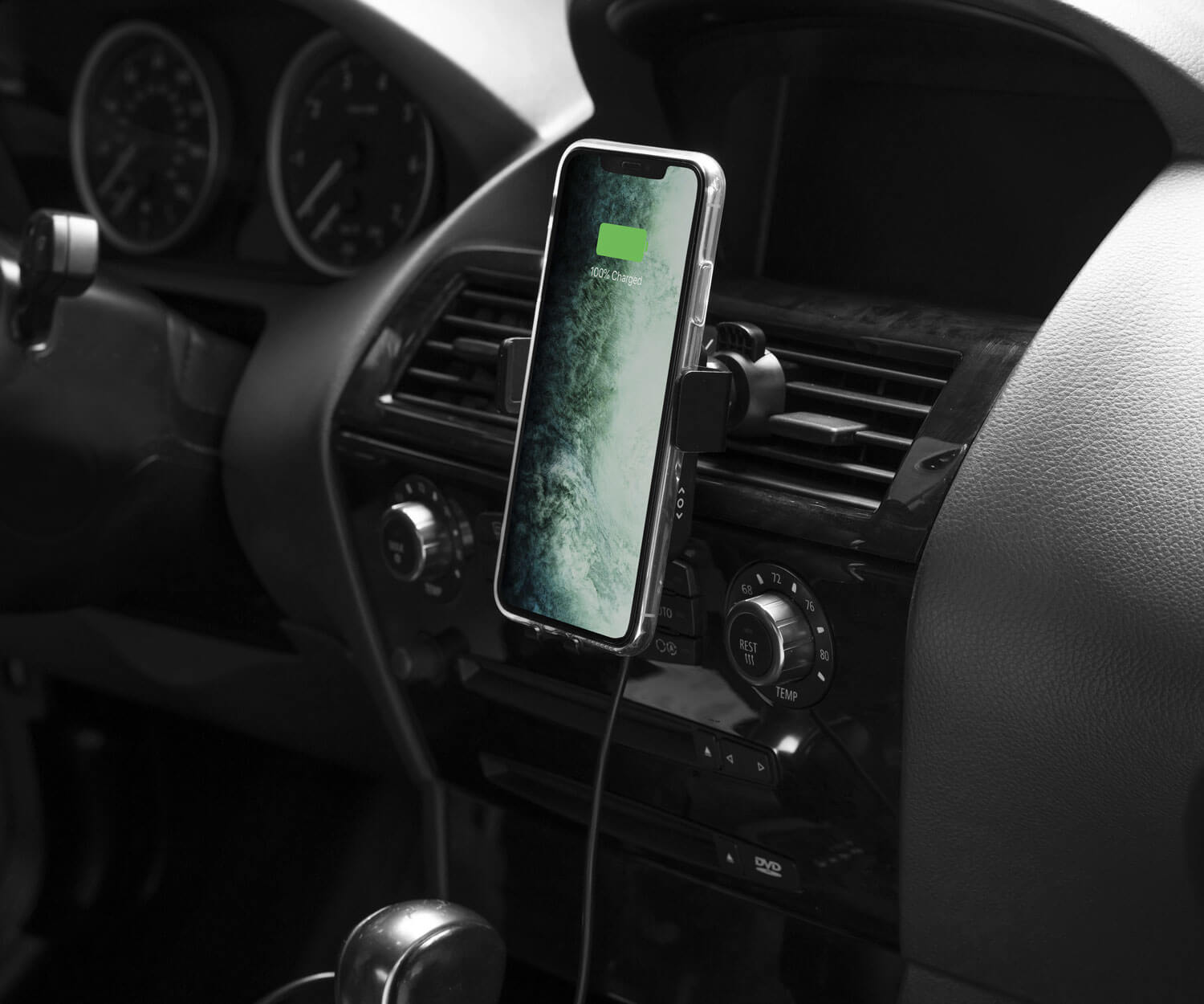 A fully charged iPhone in a car wireless charger
